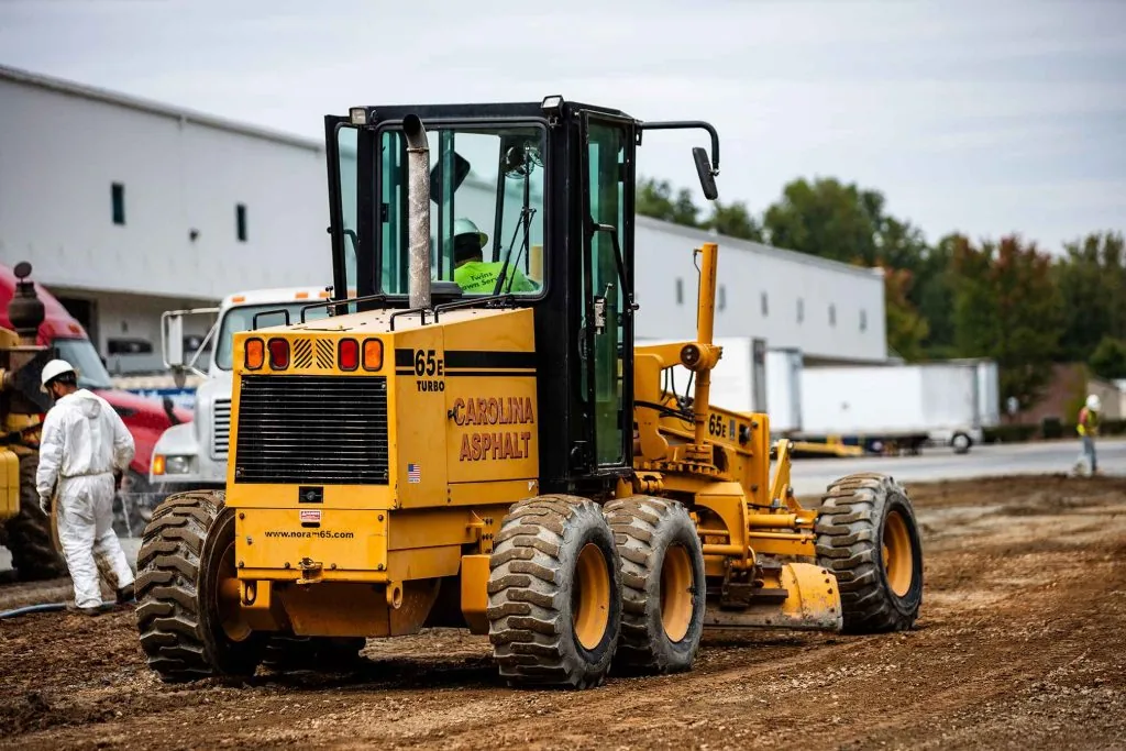 carolina asphalt paving machine on a dirt road during a full depth reclamation project in charlotte, nc